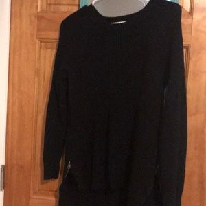 Size M. Black sweater.